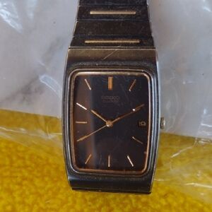 - Seiko Black and Gold Quartz Watch